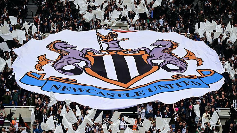 Newcastle United flag in the crowd