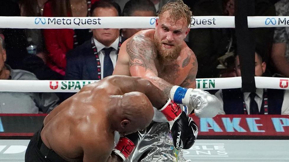 Jake Paul lands a punch on Mike Tyson during their fight at The Pavilion at AT&T Stadium in Arlington, Texas in November 2024