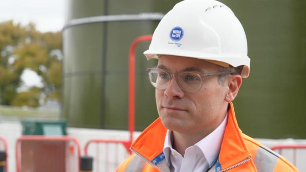 Tim McMahon of Southern Water standing in front a new water treatment works being built