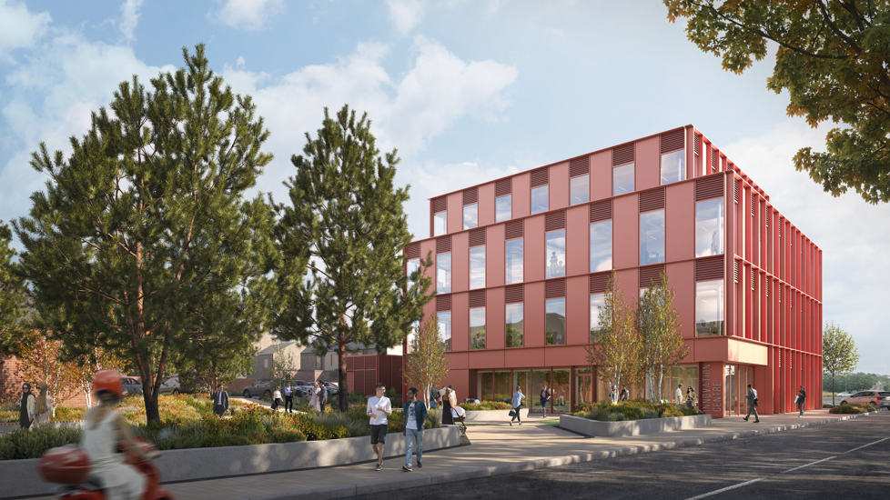 Artist's impression of Workington Innovation Centre. It is a red, four storey building clad in metal panels and plenty of windows. A green space, with trees and people sitting on the grass, is shown outside the building.