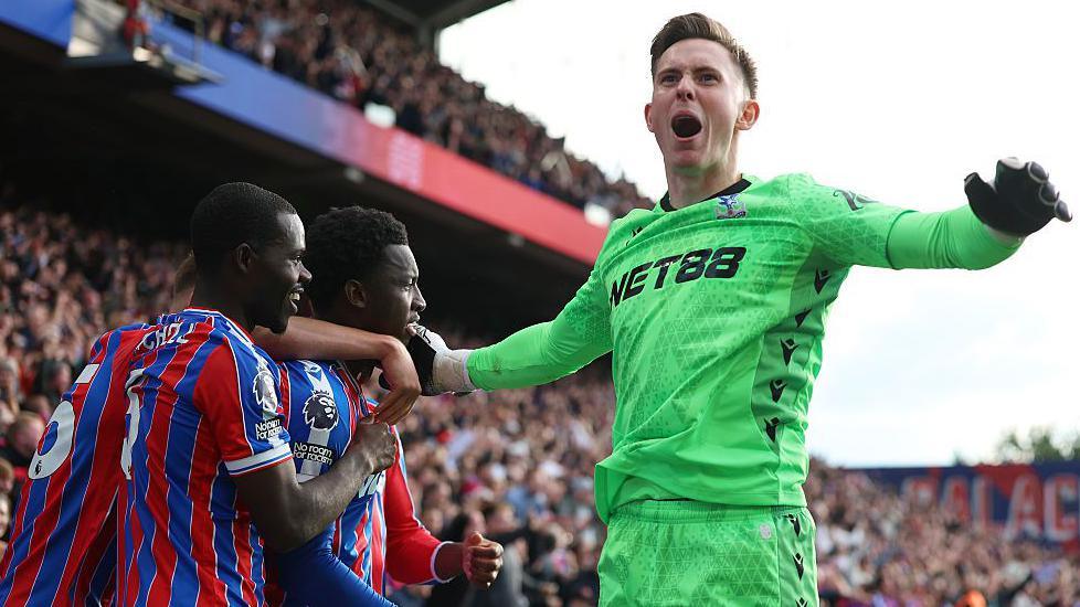 Crystal Palace goalkeeper Dean Henderson joins the celebrations after Eddie Nketiah's winner.