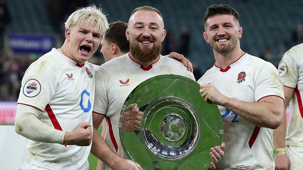 Henry Pollock, Joe Heyes and Tom Curry hold the trophy after England beat New Zealand in November