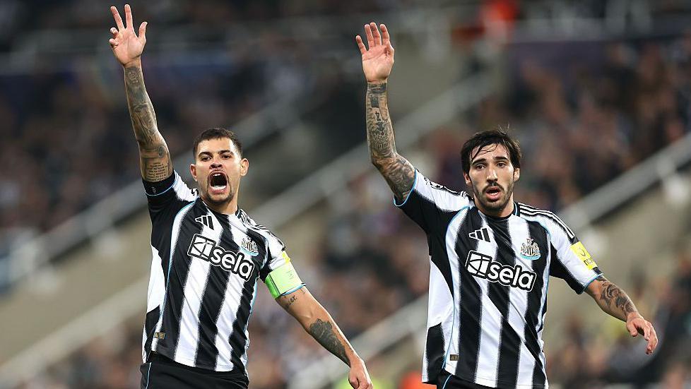 Newcastle's Bruno Guimaraes and Sandro Tonali with their hands raised