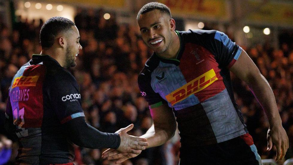 Cassius Cleaves [left] and Will Joseph [right] celebrate after Cleaves scores for Harlequins against Northampton