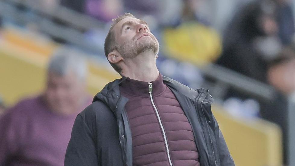 Harrogate boss Simon Weaver looking to the skies