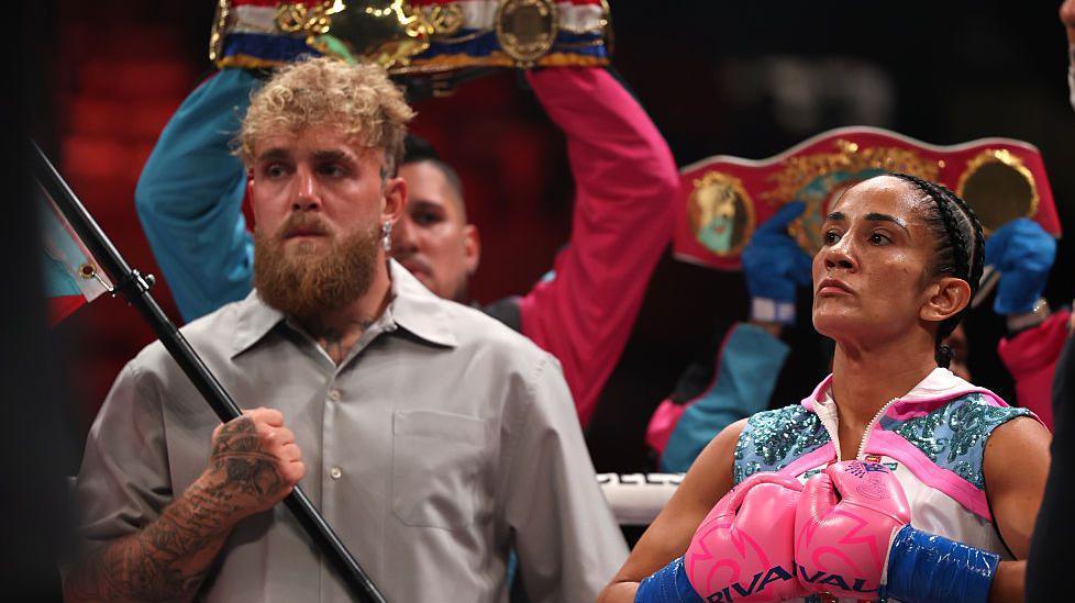 Jake Paul waves the Puerto Rico flag before Amanda Serrano's fight with Katie Taylor