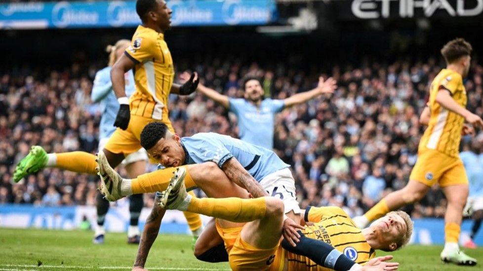 Manchester City forward Savinho and Brighton defender Jan Paul van Hecke collide at Etihad Stadium