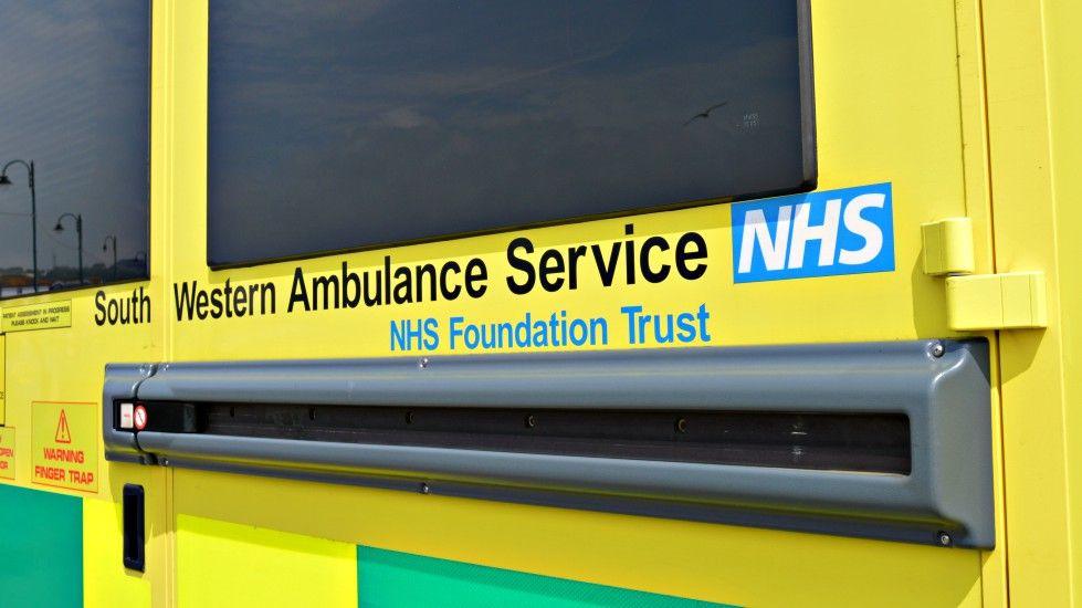 The side of an ambulance, which says "South Western Ambulance Service NHS Foundation Trust - NHS"