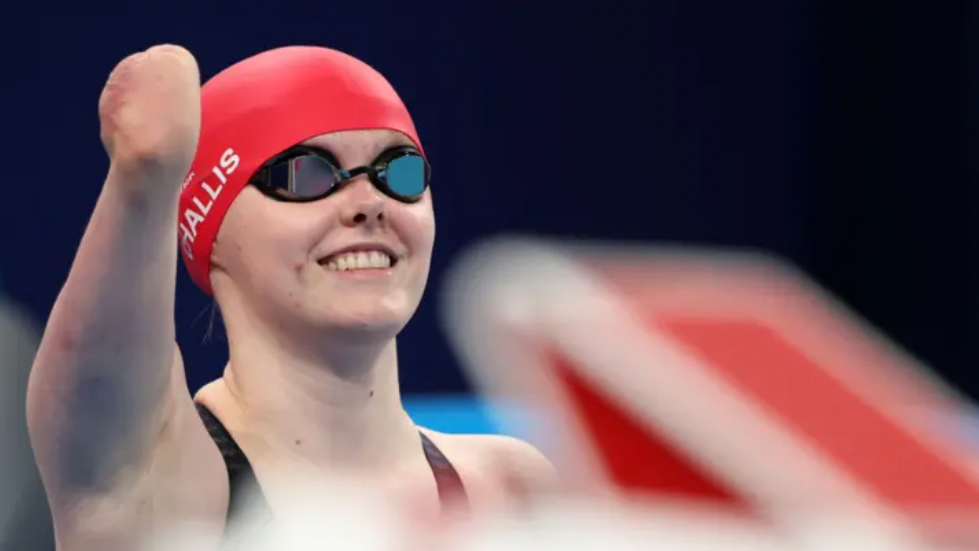 Swimmer Ellie Challis celebrates winning gold 