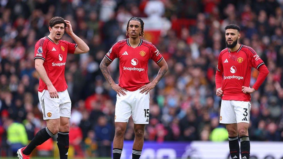 Manchester United defender Leny Yoro (centre) with Harry Maguire (left) and Noussair Mazraoui