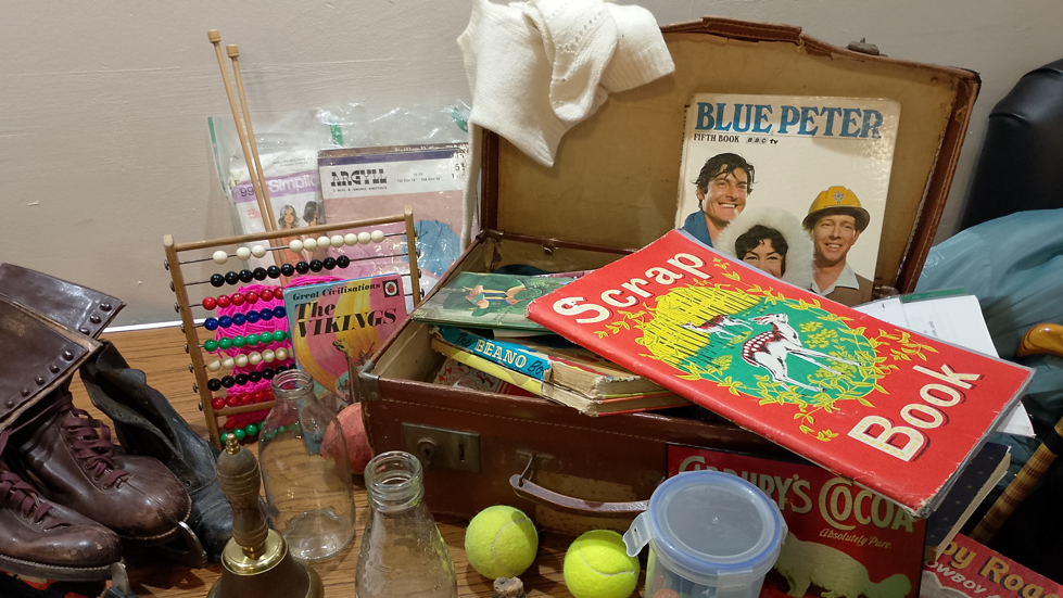 Various items including a Blue Peter annual, a scrap book, a Beano annual and tennis balls