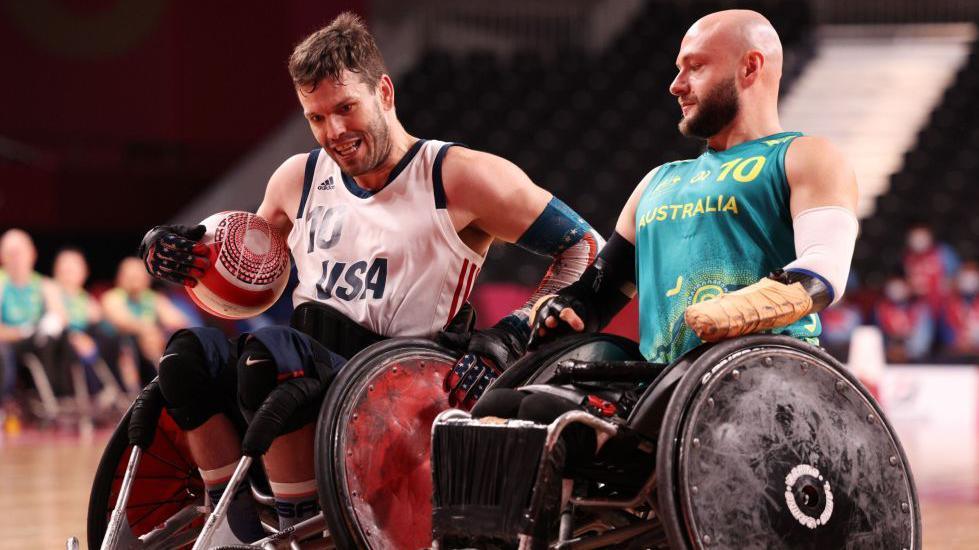 Joshua Wheeler of the United States is challenged by Australia's Chris Bond at the Tokyo Paralympics