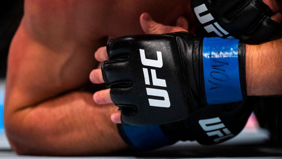 Close-up of the UFC logo on the glove of a fighter