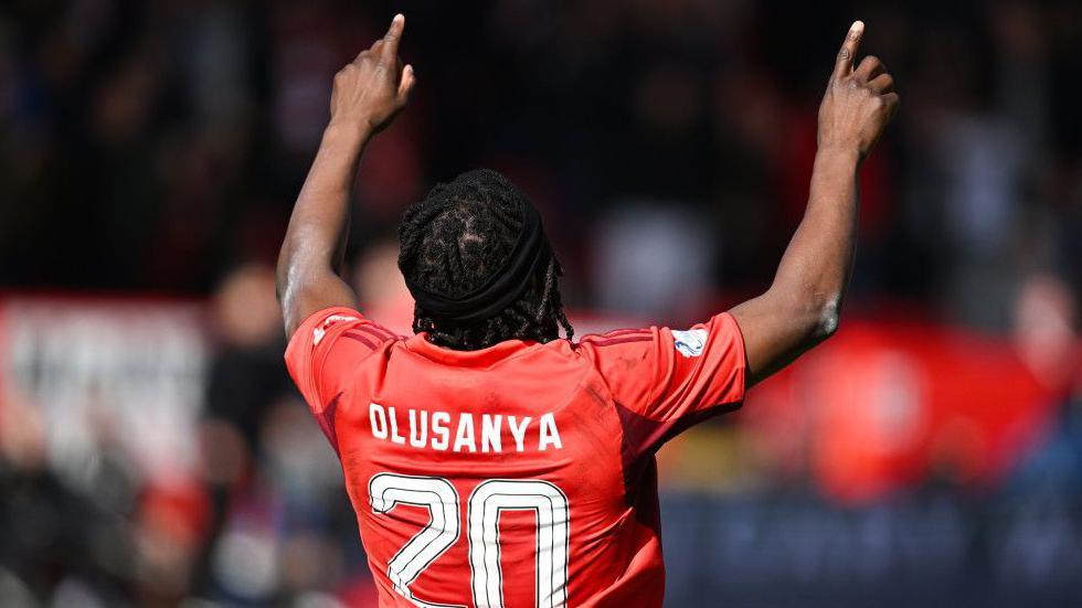Aberdeen's Toyosi Olusanya celebrates scoring to make it 2-0 during a William Hill Premiership match between Aberdeen and Dundee United at Pittodrie Stadium