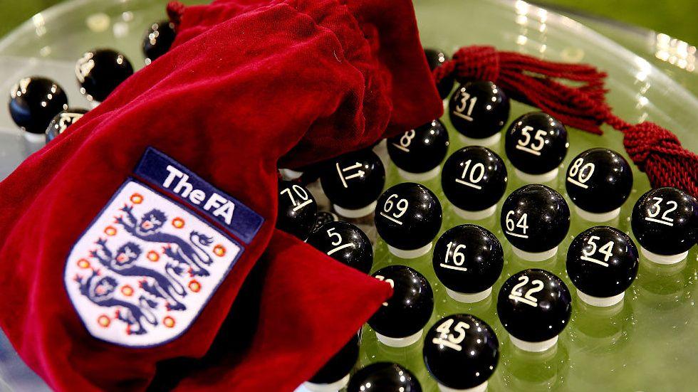 The balls being prepared for the FA Cup draw