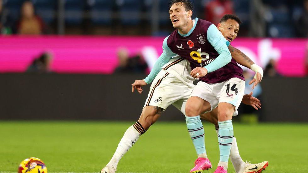 Connor Roberts and Ronald battle during Swansea's defeat at Burnley 