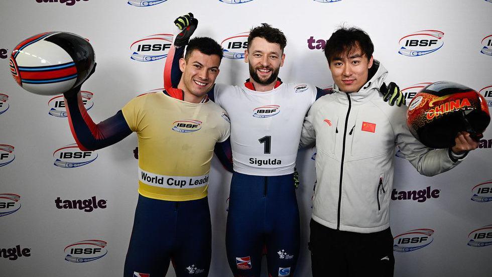 Marcus Wyatt, Matt Weston and Zheng Yin pose for a photograph 