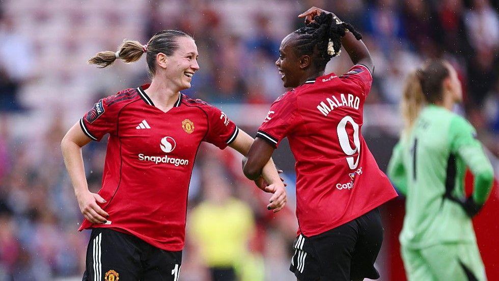 Goalscorer Elisabeth Terland (left) and Melvine Malard celebrate Manchester United's second goal against Leicester 