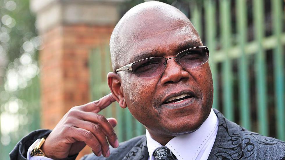 Spy boss Richard Mdluli is seen with his finger to his face as he speaks