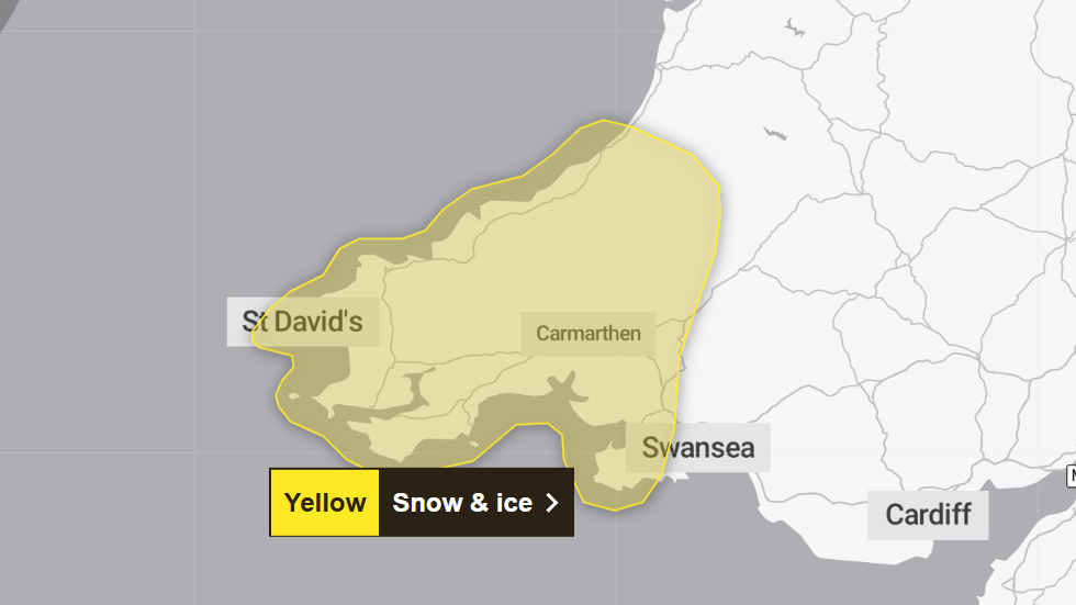 A map of Wales with patches of yellow across the south west of the country which says Yellow snow and ice warning. 