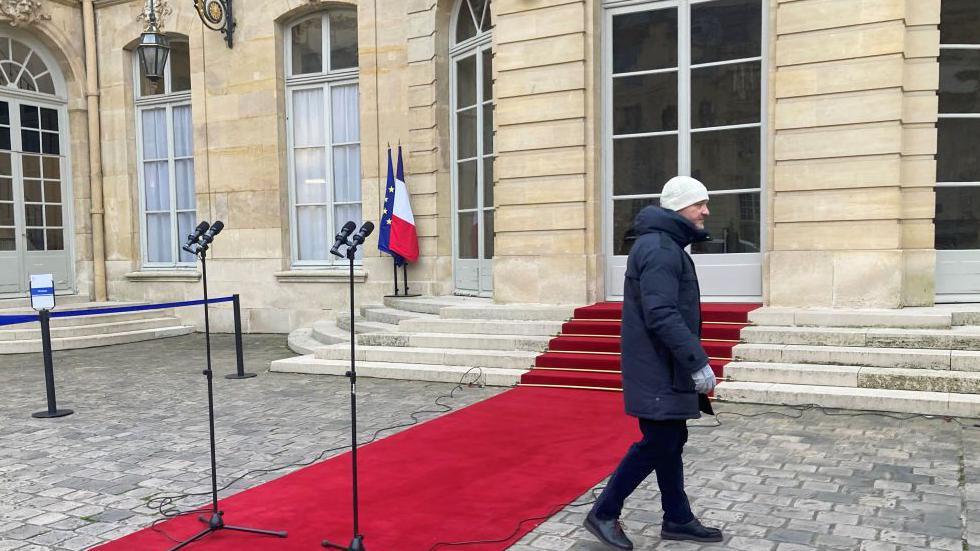 A red carpet appears outside the prime minister's residence at Hotel Matignon in the centre of Paris.