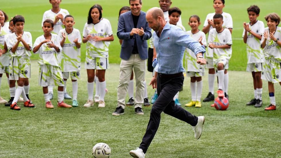 Prince William taking a penalty