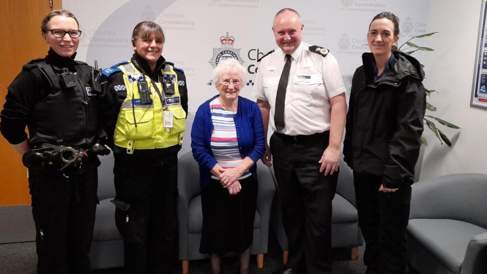 Betty Chesters with police officers 