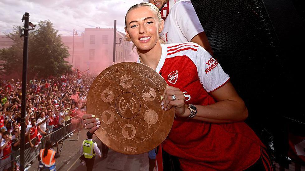 Arsenal's Chloe Kelly with Women's Champions Cup trophy