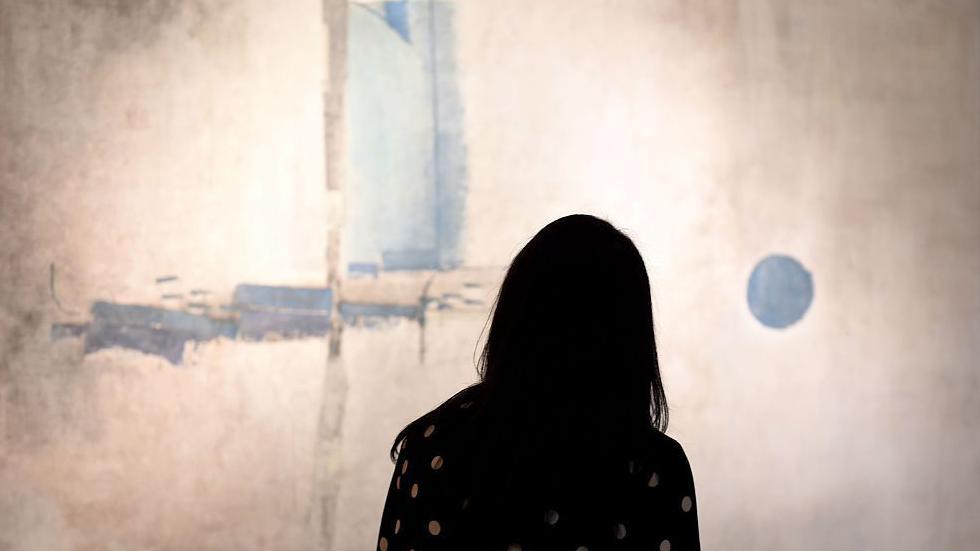 A woman looks at Gaitonde's Untitled in the Modern & Contemporary South Asian Art Sale during a media preview March 10, 2016 for Sotheby's New York Asia Week Auction and Selling Exhibitions 