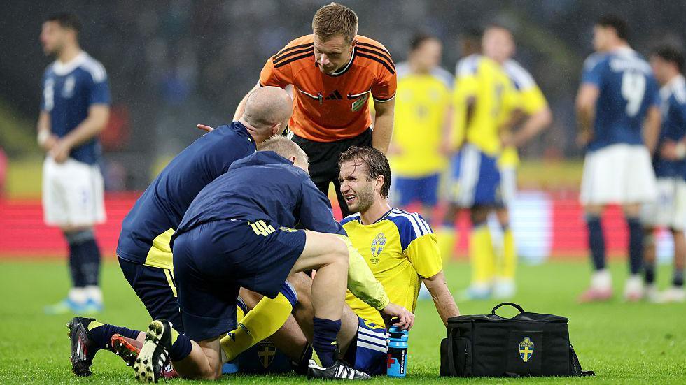 Benjamin Nygren of Sweden receives medical treatment during the international friendly match between against Greece
