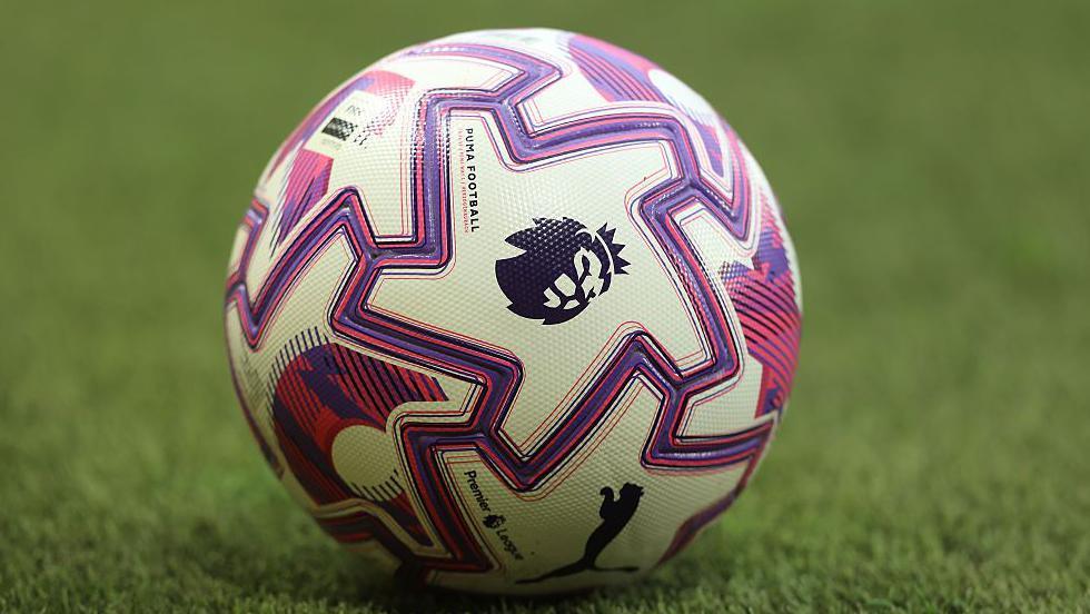 Image of a white ball with zig -zagged purple markings.