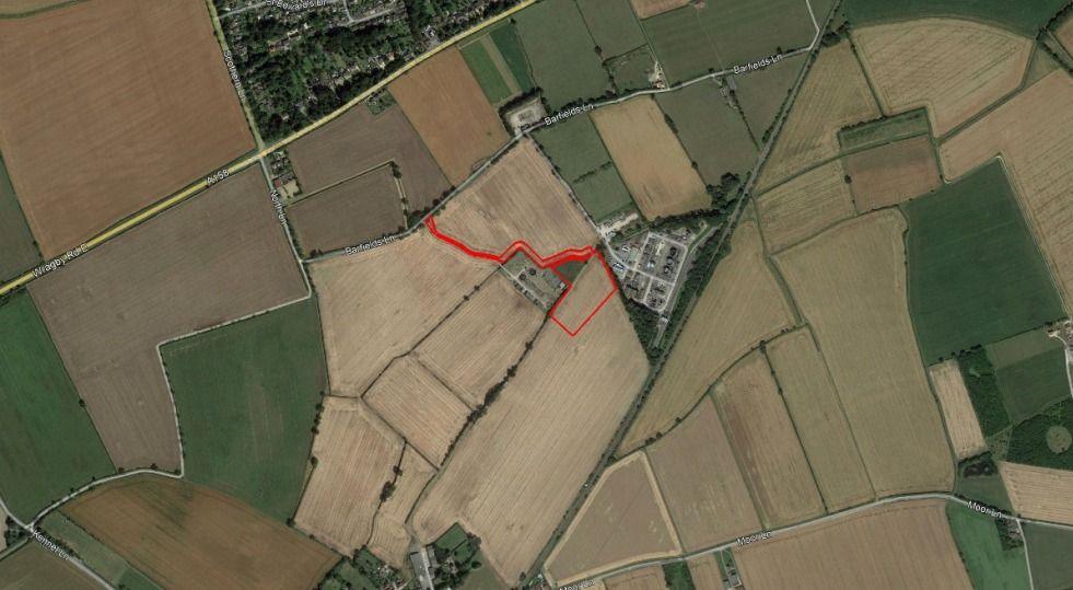 A map of the proposed battery energy storage system. The aerial shot shows mainly fields and also the nearby oil production facility. 