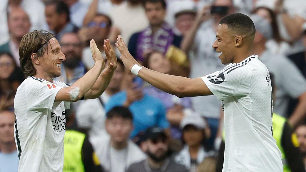 Mbappe and Modric celebrate