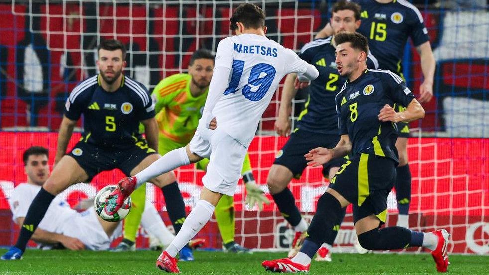 Greece midfielder Konstantinos Karetsas shoots against Scotland