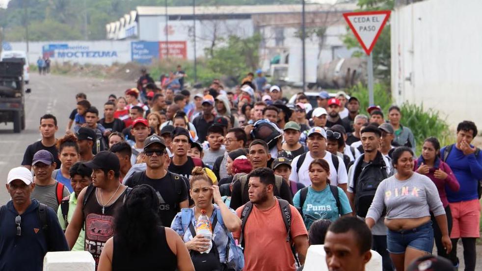 Migrants of various nationalities walk in a caravan to head to the border with the United States, in the municipality of Tapachula in the state of Chiapas, Mexico, 20 May 2024. 