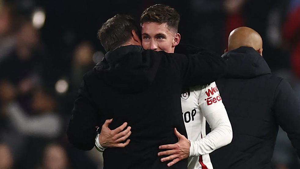 Harry Wilson and Marco Silva embrace after Fulham's victory over Brentford