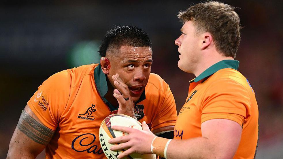 Allan Alaalatoa speaks to Australia team-mate Billy Pollard during the first Lions Test in Brisbane