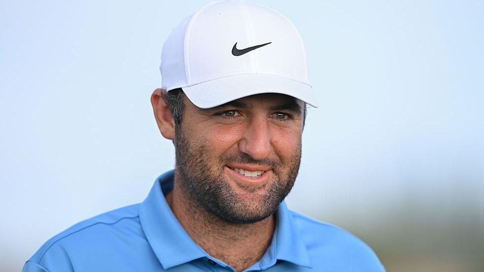 Scottie Scheffler smiles during a round