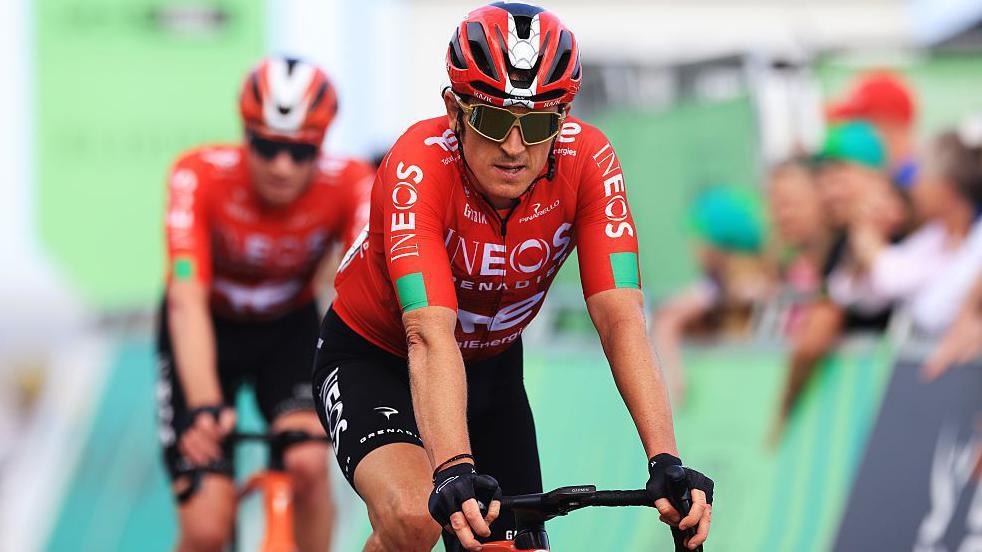 Geraint Thomas of Great Britain and Team INEOS Grenadiers crosses the finish line
