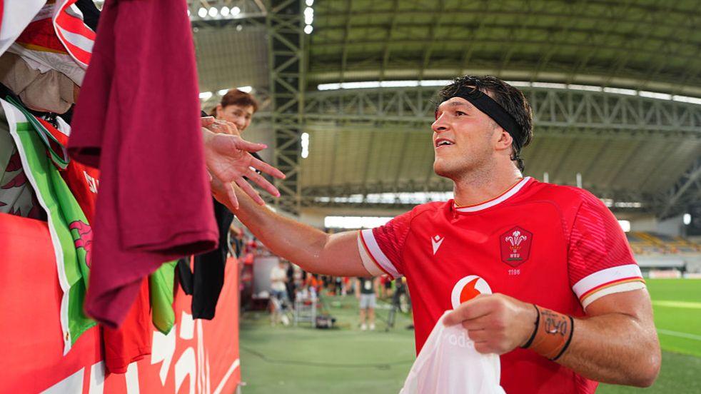 Wales' Teddy Williams celebrates with fans
