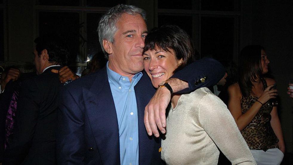 Jeffrey Epstein and Ghislaine Maxwell pose for a photograph at a party