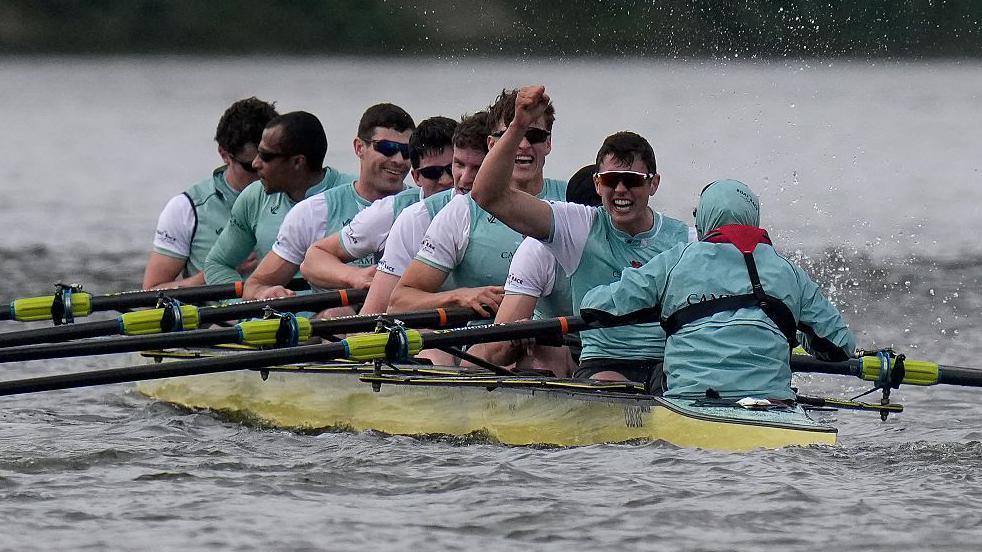 Cambridge celebrate victory in the men's Boat Race