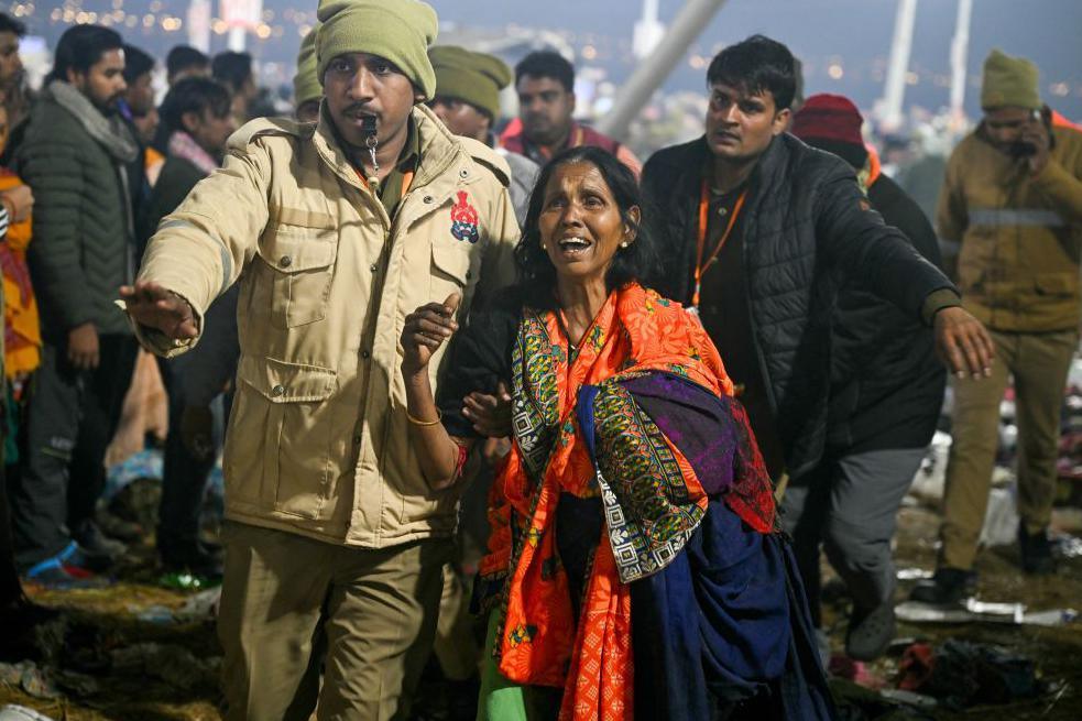 A devotee weeps at the site of stampede amid the ongoing Maha Kumbh Mela festival in Prayagraj on January 29, 2025. 