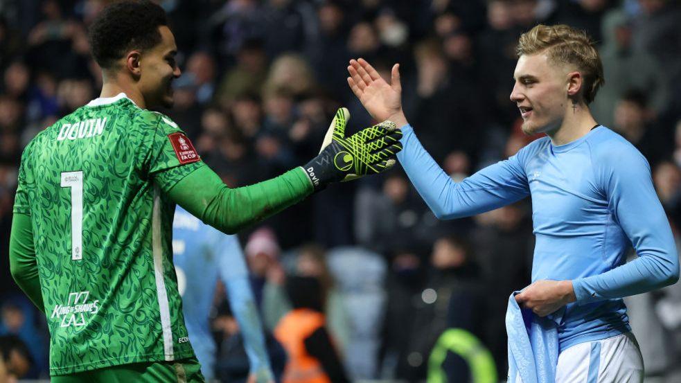 Coventry City's penalty shootout heroes Oliver Dovin (left) and Norman Bassette celebrate the team's FA Cup victory over Sheffield Wednesday