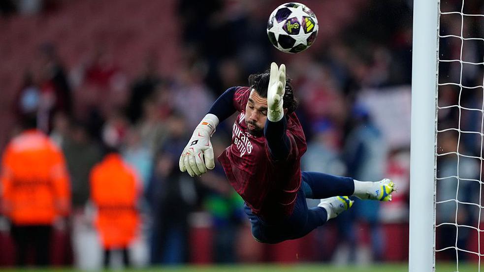 Arsenal goalkeeper David Raya makes a save