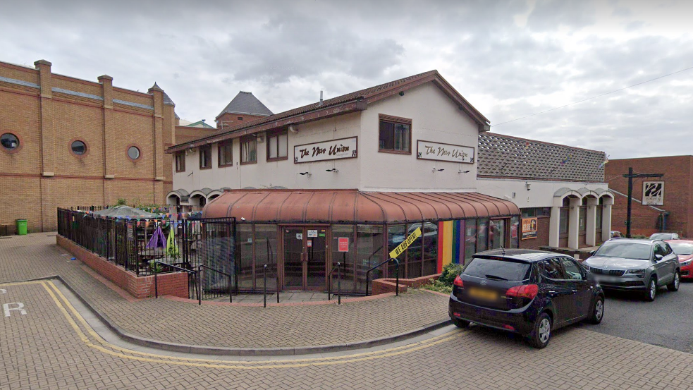 Street view image of the New Union pub, a two-storey building with a beer garden and a glass-fronted entrance. 