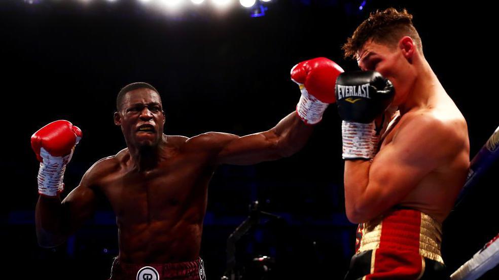 Richard Riakporhe throws a left hook at Chris Billam-Smith