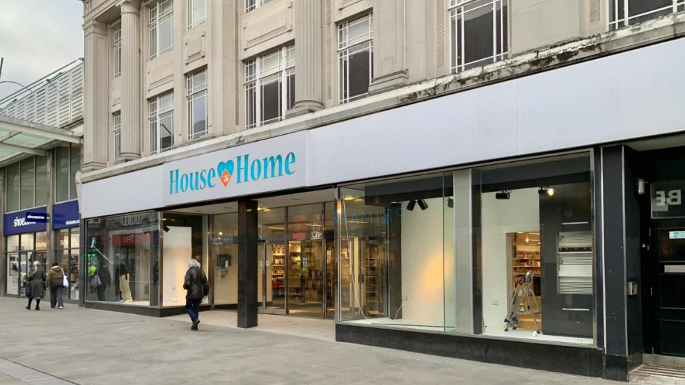 A large department store frontage, with the name, House to Home, across the top of the ground floor and several pedestrians walking past