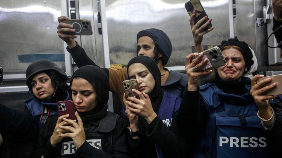 Palestinian journalists mourn the body of Shatha al-Sabbagh, a journalism student, at Jenin Government Hospital, 29 December