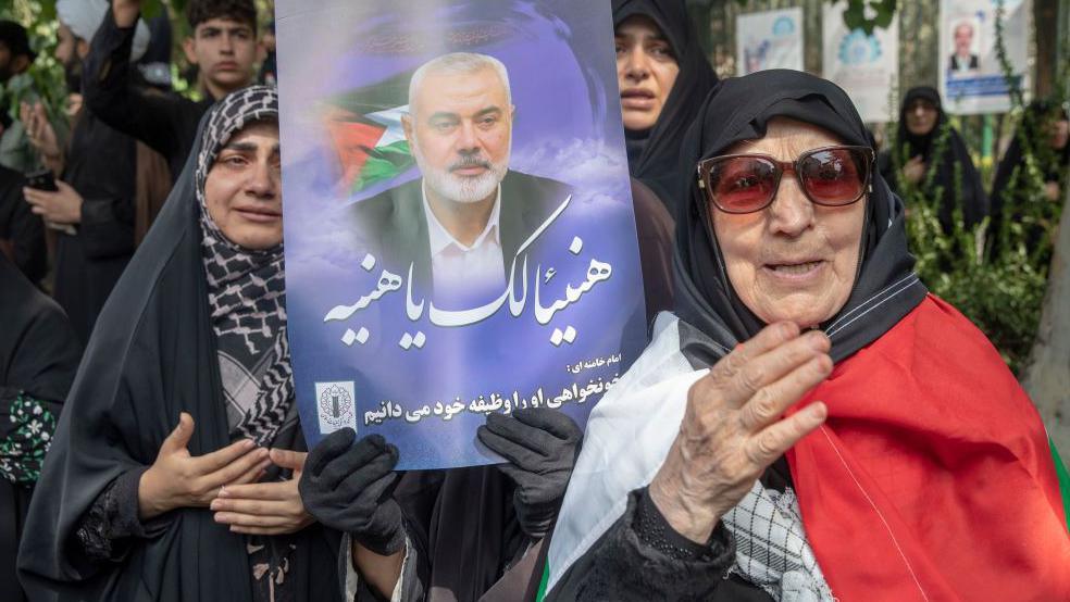 Iranians attend the funeral procession of assassinated Hamas chief Ismail Haniyeh 